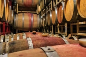 small business winery wine barrels stacked