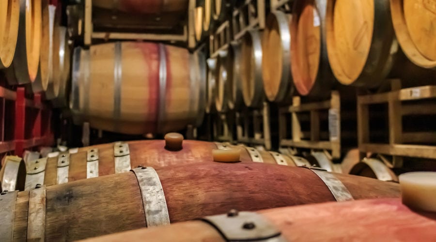 small business winery wine barrels stacked